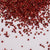 Fruto seco redondo, chico y de color rojo.